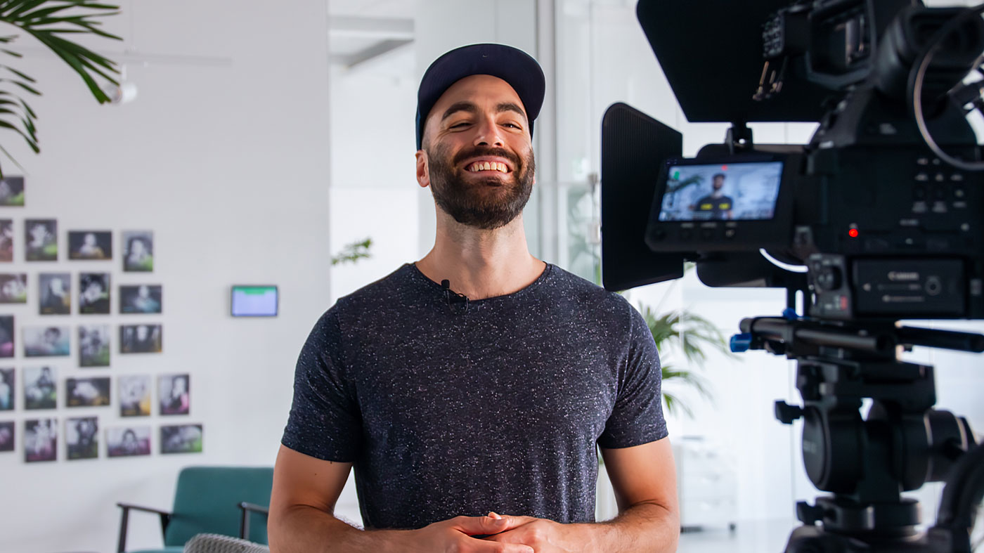 shot of a person being interviewed from behind the camera (Photo)